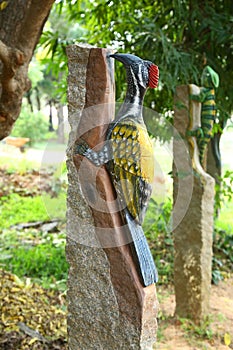 garden woodpecker statue