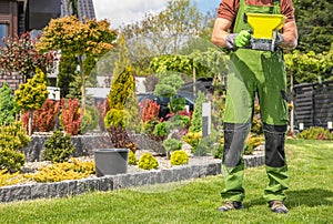 Garden Worker with Handheld Seeder