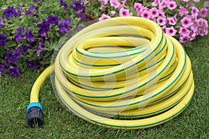 Garden yellow plastic hose-pipe