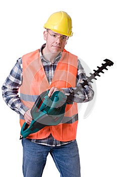 Gardener with hedge trimmer