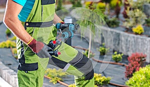 Gardener Holding Drip Irrigation Components