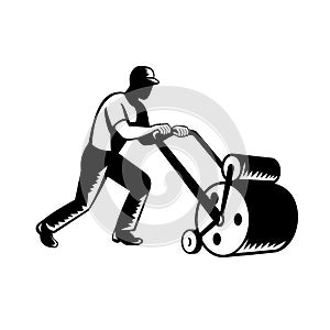 Gardener Landscaper Groundsman or Groundskeeper Pushing Lawn Roller Woodcut Black and White photo