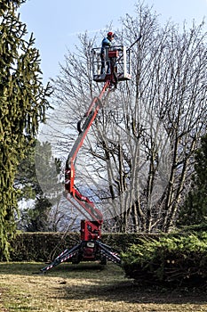 A gardener moves by his tracked basket