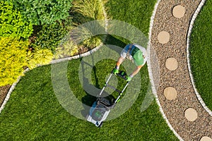 Gardener Mowing Backyard Garden Grass Aerial View