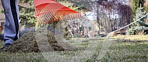 Gardener Operating Soil Aeration Machine on Grass Lawn