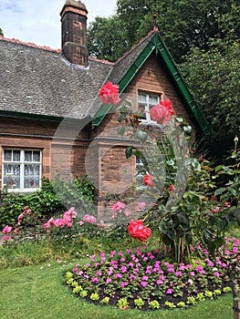 The Gardener`s Cottage with beautiful roses in Princes Street Gardens, Edinburgh, Scotland