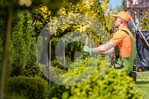 Gardener Trimming Plants