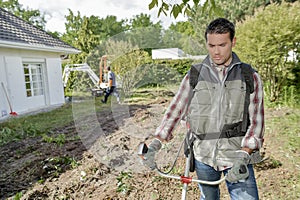 Gardener using a strimmer