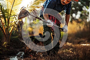 Gardeners use a hoe to remove weeds and dig trenches for farming