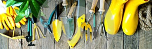 Gardening banner. Garden tools on the wooden weathered terrace