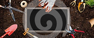 Gardening banner illustration - garden tools and shalkboard on brown soil