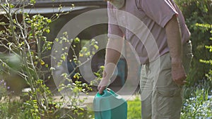 Gardening elderly Senior retired grandfather man sitting outdoors