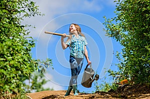 Gardening guide for beginners. Gardening tips. Spring gardening. Girl child hold shovel watering can. Spring gardening