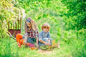 Gardening with a kids. Children enjoy in farm. Kids portrait on farmland. Spring gardening routine. Happy kids on summer