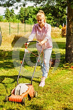 Gardening. Mowing lawn with lawnmower