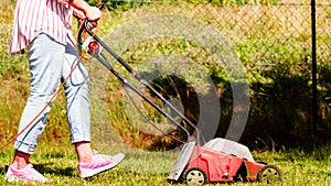 Gardening. Mowing lawn with lawnmower
