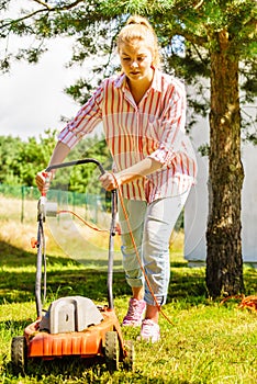 Gardening. Mowing lawn with lawnmower