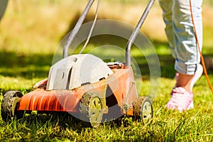 Gardening. Mowing lawn with lawnmower