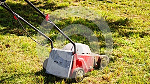 Gardening. Mowing lawn with lawnmower