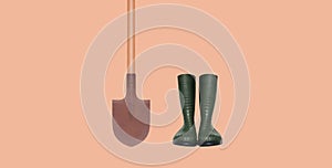 Gardening set tools, rubber boots and shovel isolated on brown background