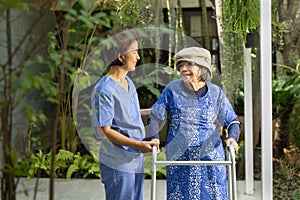 Gardening therapy in dementia treatment on elderly woman at nursing home photo