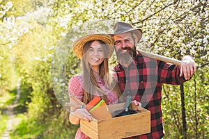 Gardening is thier hobby. Happy couple hold gardening tools. Gardening and homesteading. Hobby farm. Gardening and