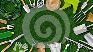 Gardening tool equipment. Top view isolated on lawn green grass background with copy space. Online shopping commerce, banner for