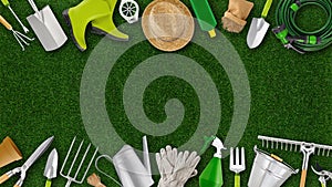 Gardening tool equipment. Top view isolated on lawn green grass background with copy space. Online shopping commerce, banner for