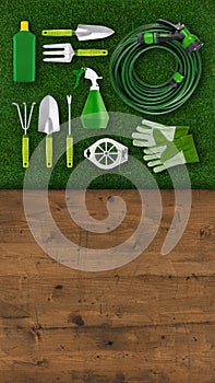 Gardening tool equipment. Top view on lawn grass, wooden table background with copy space. Online shopping commerce or advertising