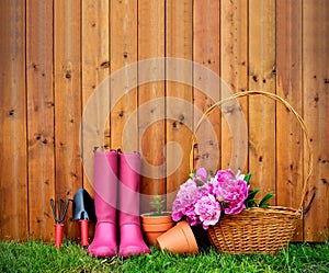 Gardening tools and objects on old wooden background