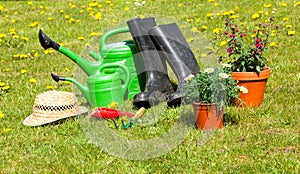 Gardening tools and a straw hat