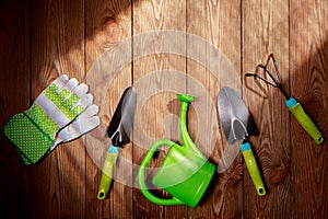 Gardening tools on vintage wooden table - spring. Spring flowers and garden tools on wooden table