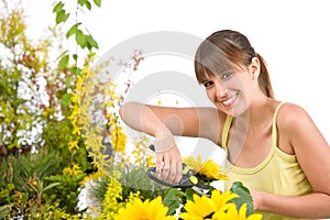 Gardening - woman cutting with pruning shears photo