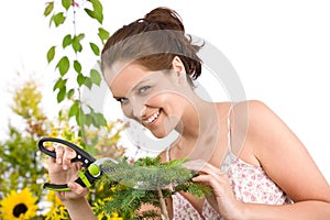 Gardening - woman cutting tree with shears photo