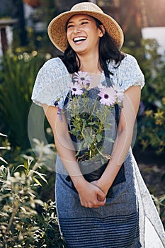 Gardening, woman and holding plant in outdoor for environment, sustainability or ecology. Nature, laughing and female