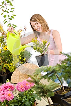 Gardening - woman pouring water to plant