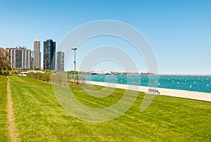 Gardens of Chicago Grant Park with lake Michigan and skyscrapers on background, USA