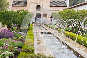 Gardens and fountain of generalife in granada photo
