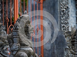 Gardian statue at the Bali temple entrance photo
