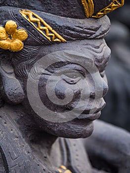 Gardian statue at the Bali temple entrance photo