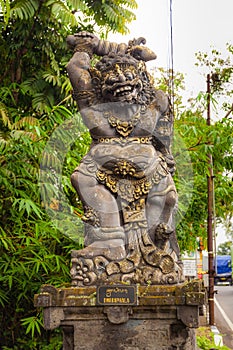 Gardian statue at entrance Bali temple photo