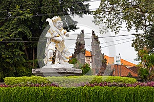 Gardian statue at entrance Bali temple photo