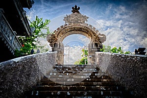 Gardian statue gate at entrance Bali temple photo