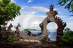 Gardian statue gate at entrance Bali temple photo