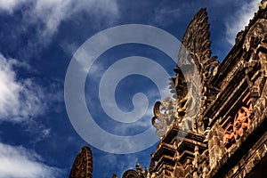 Gardian statue gate at entrance Bali temple photo