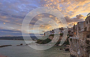 Gargano coast: bay of Vieste.-(Apulia) ITALY-Panoramic view of the old city at sunset.