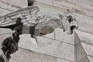 A gargoyle on SacrÃ©-CÅ“urâ€™s western faÃ§ade