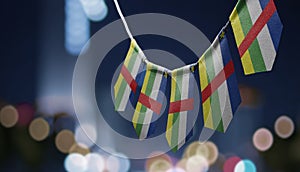 A garland of Central African Republic national flags on an abstract blurred background