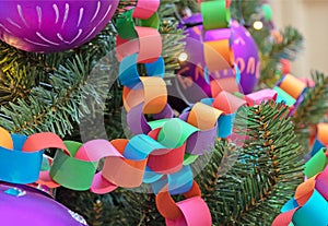 Garland-chain made of colored paper on Christmas tree. Christmas and New Year\'s decor