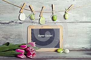 Garland decorated eggs, and blackboard for message